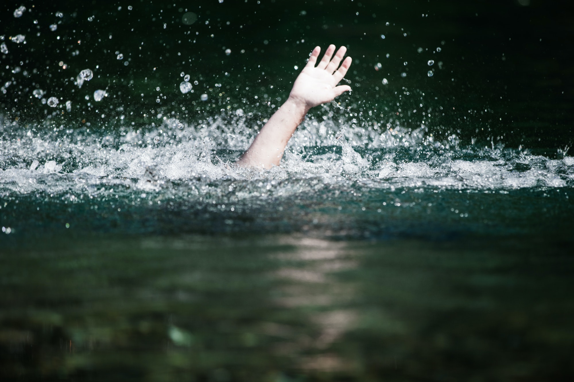 Hand of Someone Drowning and in Need of Help