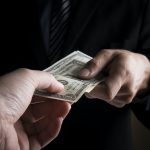 Young business people hands and money
