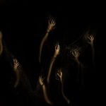 Dark hands in the darkness of the forest